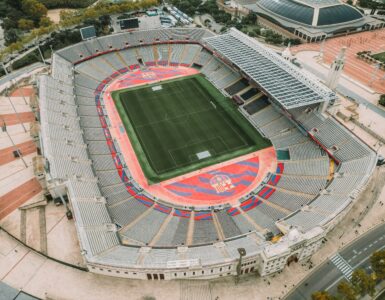 Aerial view of a soccer stadium and pitch from above.