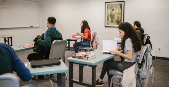 Students studying and taking notes in a language classroom