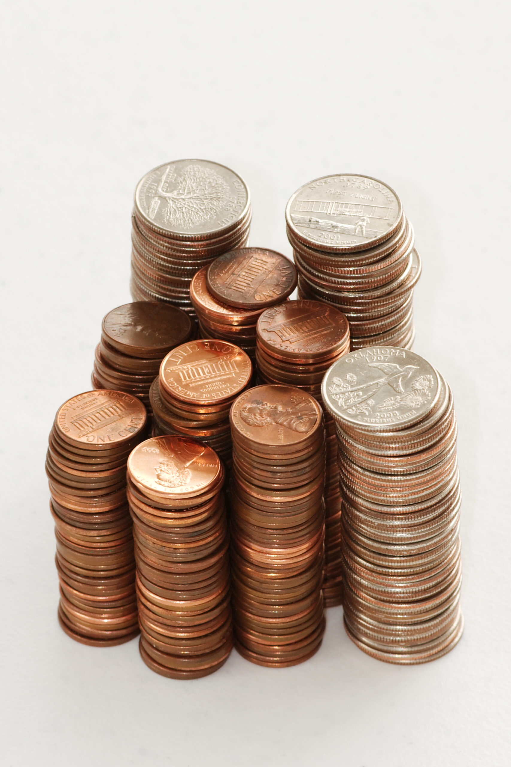 Stacks of U.S. quarters and pennies arranged at different heights