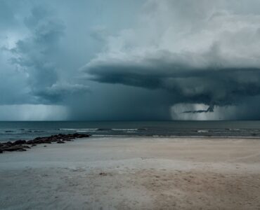 Dark storm clouds gathering over the ocean before a coastal storm