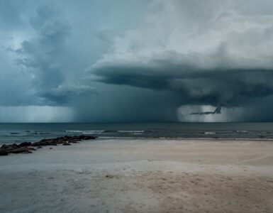 Dark storm clouds gathering over the ocean before a coastal storm