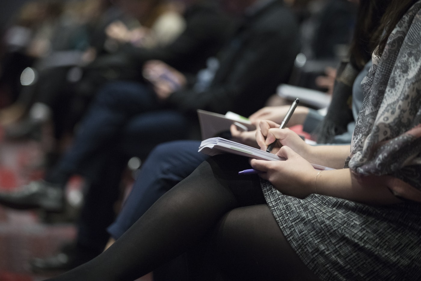 A student taking notes during an academic planning session.