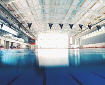 Indoor swimming pool lanes with clear blue water