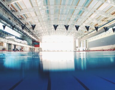 Indoor swimming pool lanes with clear blue water