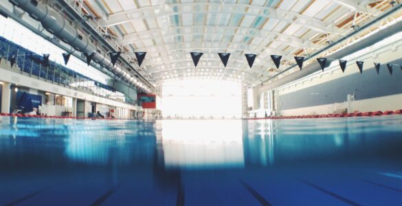 Indoor swimming pool lanes with clear blue water