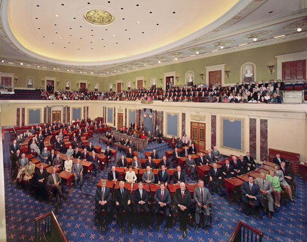 The United States Senate chamber during a formal session with senators seated at desks.