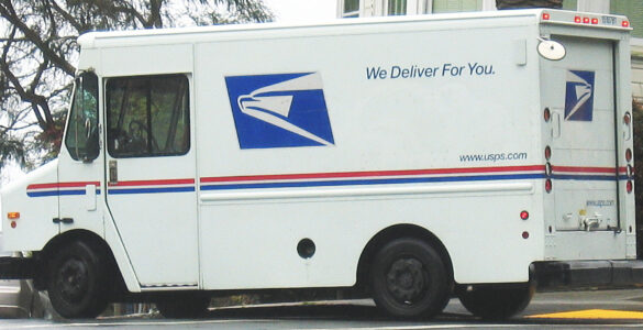 A USPS delivery truck on a residential street, representing how ZIP Codes connect addresses to delivery routes
