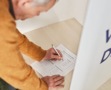 A voter marking a ballot inside a polling station