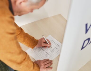 A voter marking a ballot inside a polling station