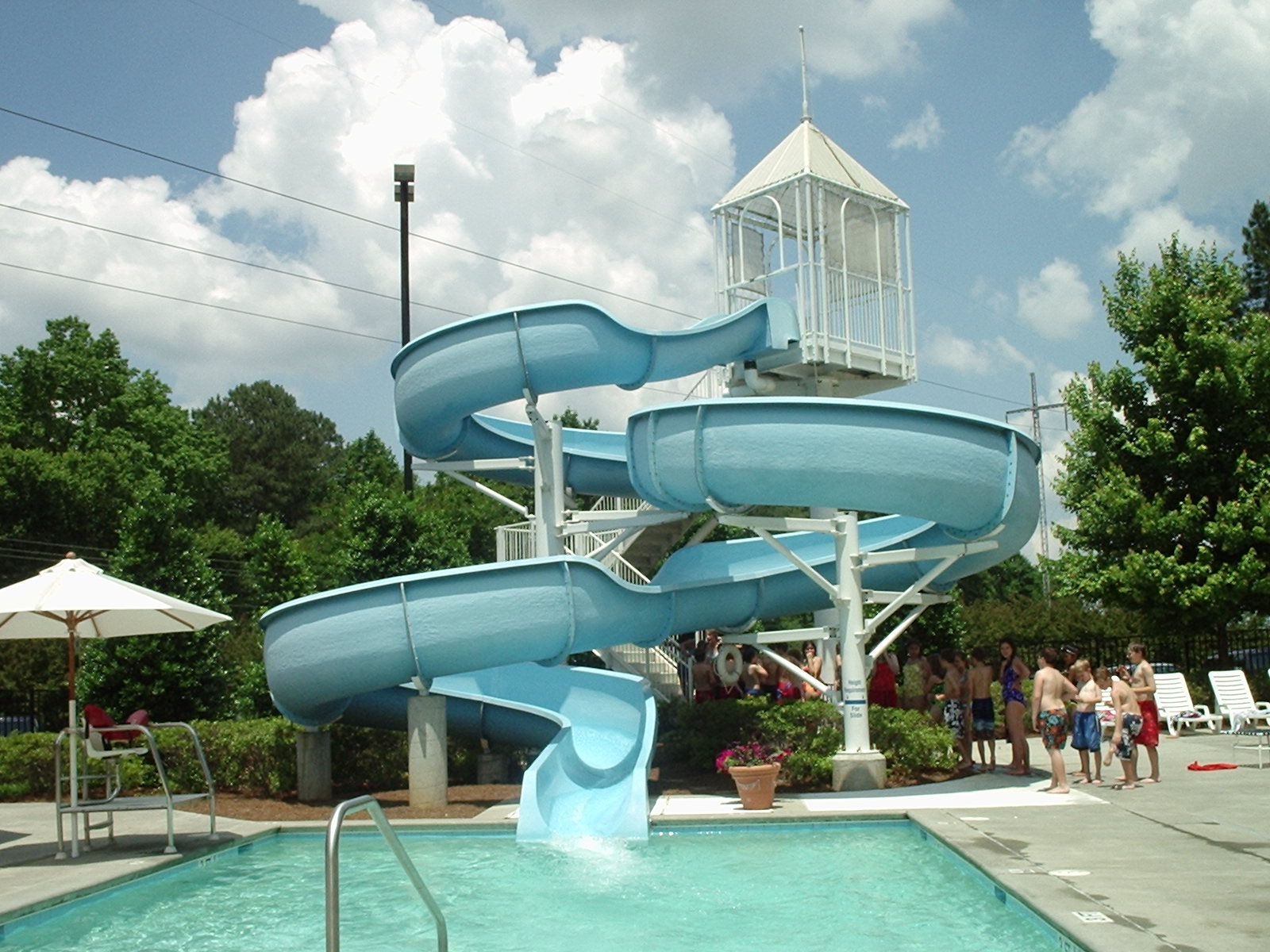 A water slide ending in a swimming pool