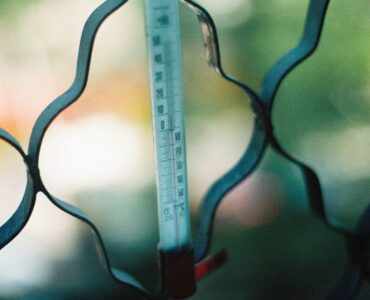 Close-up of an outdoor thermometer used to think about heat and humidity measurements.