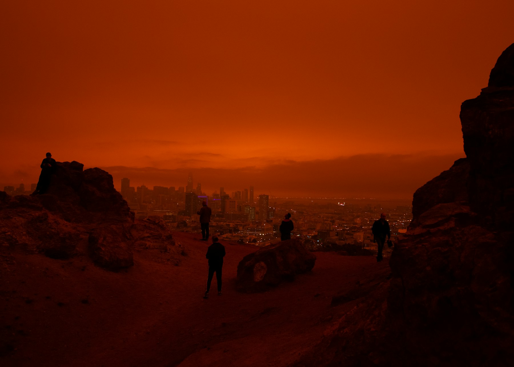 Wildfire smoke hangs over a city skyline, a condition often tracked with PM2.5 sensors and official monitors.