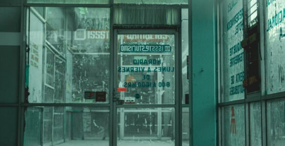 Glass automatic doors at a store entrance where sensors can detect someone approaching.