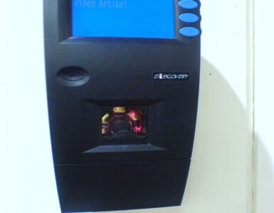 A supermarket barcode scanner used to read product codes from packages.