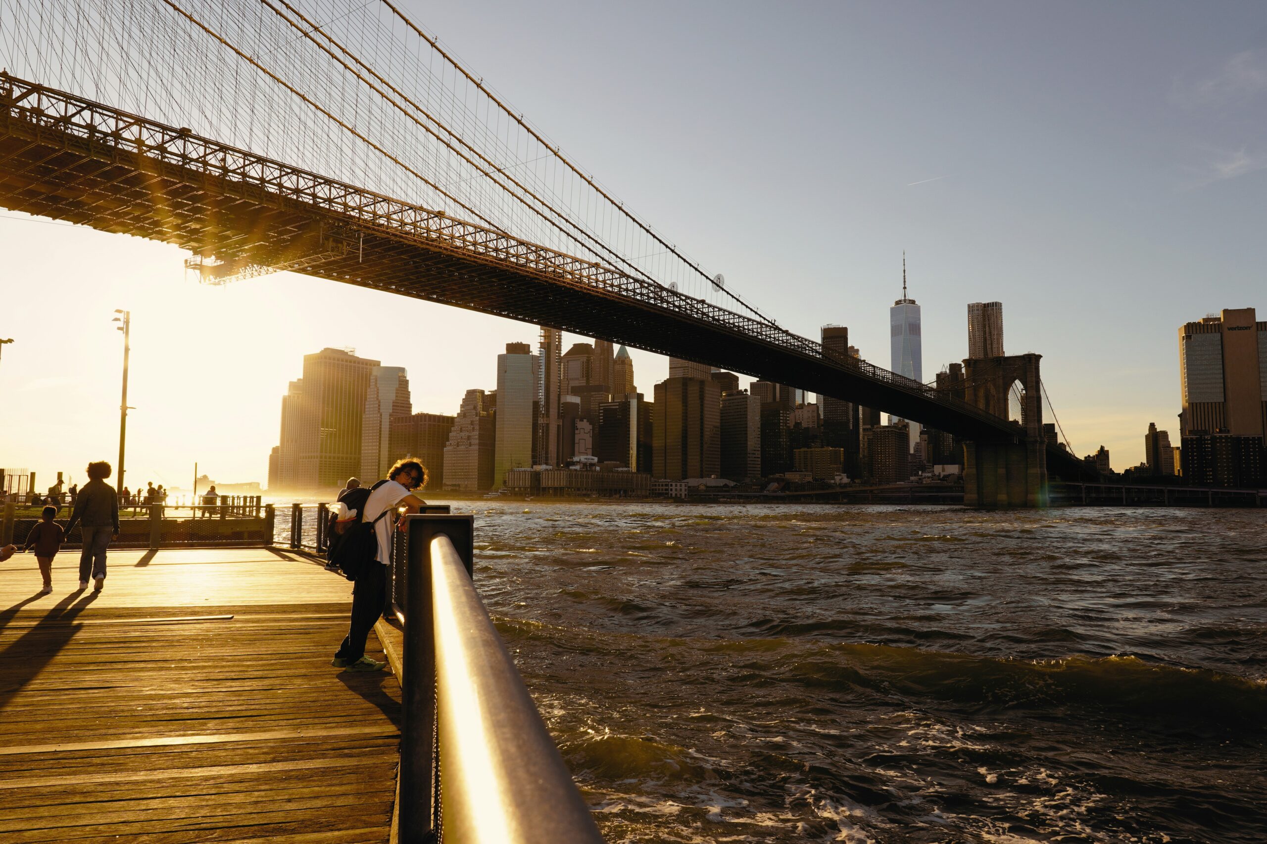 Sunset light beside the Brooklyn Bridge with the Manhattan skyline in the distance