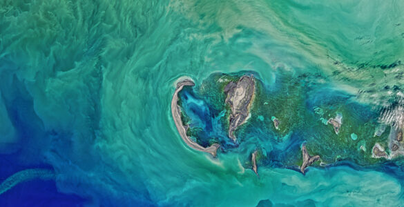 A calm stretch of the Caspian Sea coastline, showing the broad inland water body at the center of the region.
