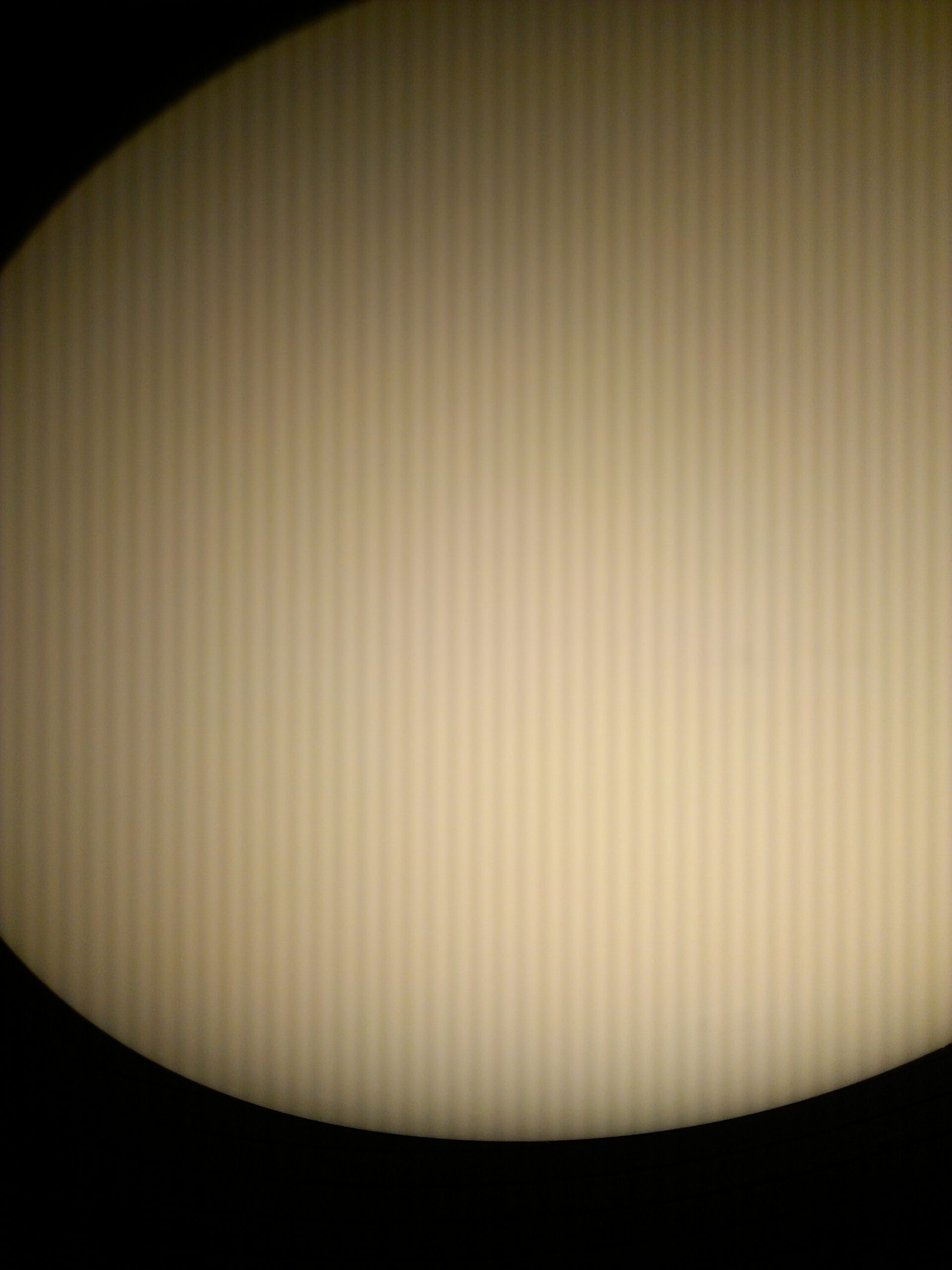 A phone camera view of artificial light, showing how camera sensors and software interpret changing brightness.