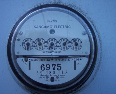 Close-up of a household electric meter used to measure electricity consumption in kilowatt-hours.