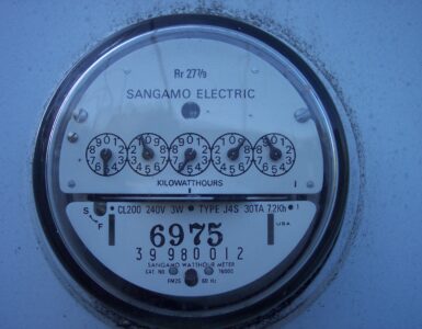 Close-up of a household electric meter used to measure electricity consumption in kilowatt-hours.