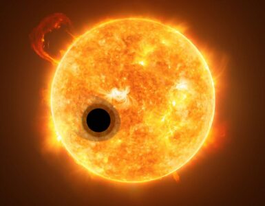 Artist concept of an exoplanet crossing in front of a bright star during a transit.