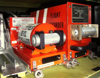 A flight data recorder and cockpit voice recorder mounted in the rear fuselage of an aircraft.