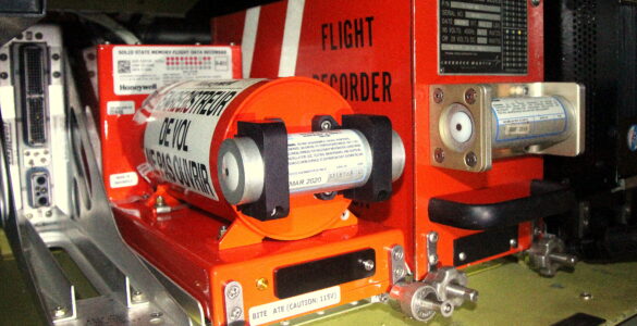 A flight data recorder and cockpit voice recorder mounted in the rear fuselage of an aircraft.