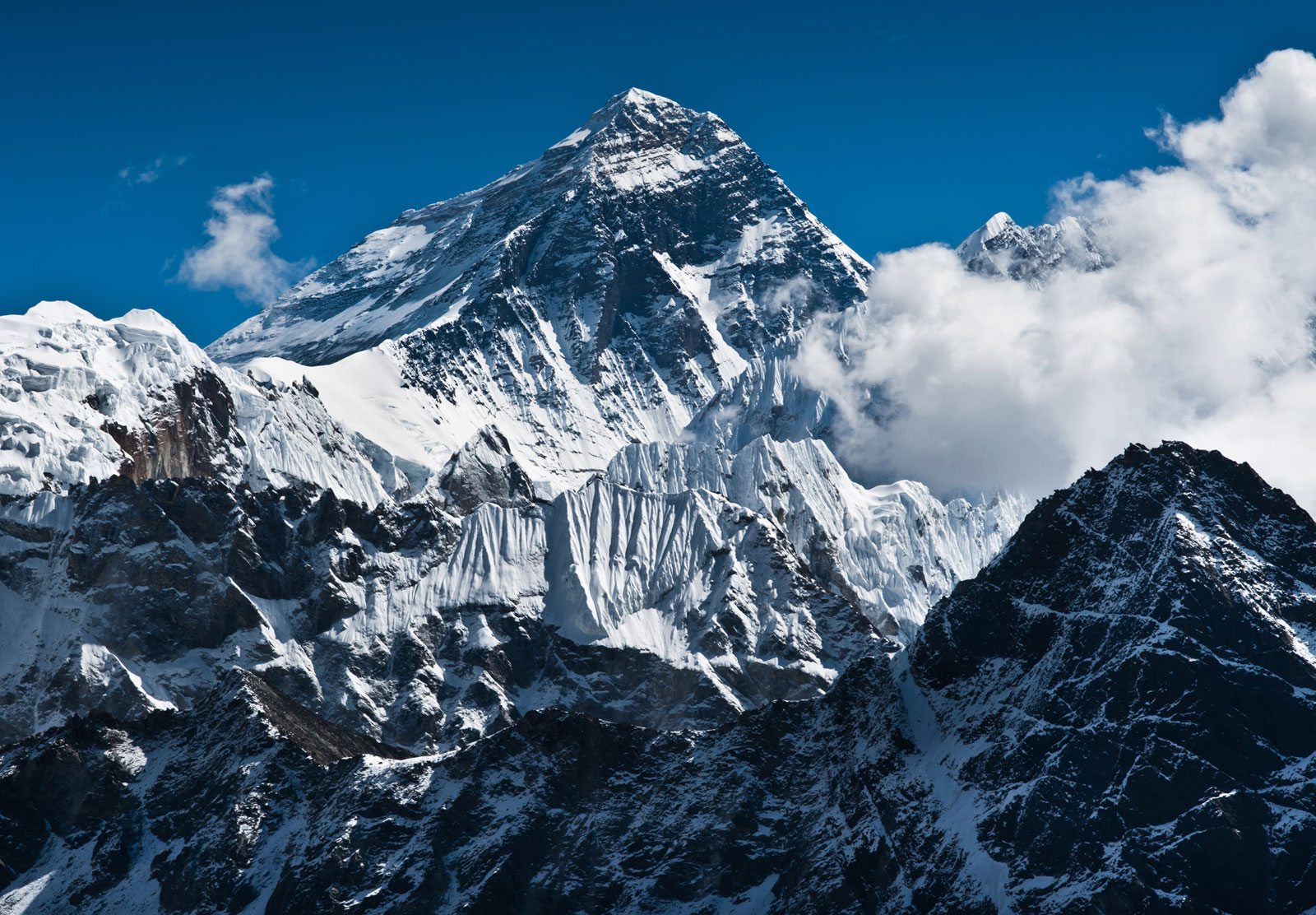 Snow-covered mountains where thinner air lowers atmospheric pressure and changes water’s boiling point.