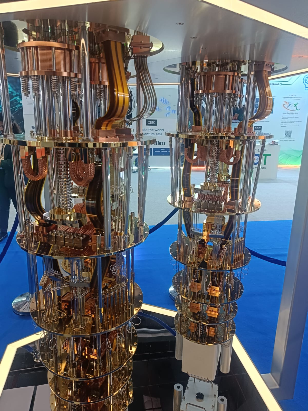 A displayed IBM quantum computer demonstration model with visible cooling hardware and cables.