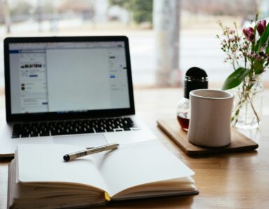 A notebook and laptop used to turn school goals into specific if-then study plans.