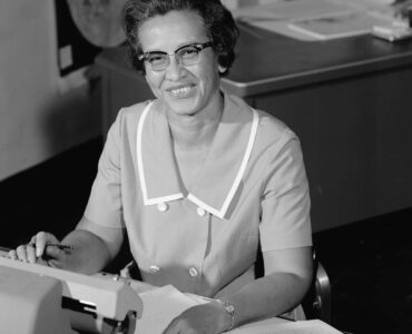 Katherine Johnson seated at a desk at NASA Langley in 1966