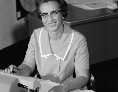Katherine Johnson seated at a desk at NASA Langley in 1966