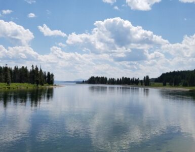 A calm summer lake where warm surface water can form a separate layer above colder deep water.