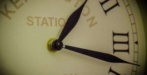 Close view of an analog clock face representing precise timekeeping and leap seconds