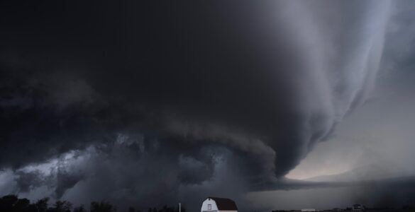 A large thunderstorm over open land where powerful downdrafts can produce damaging microburst winds.