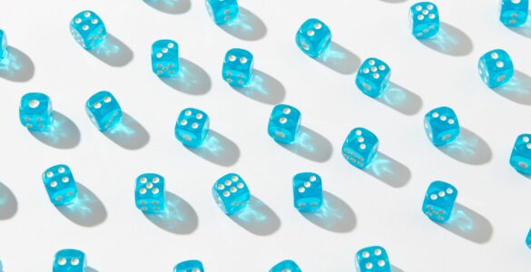 Blue dice representing repeated random trials in a Monte Carlo simulation.