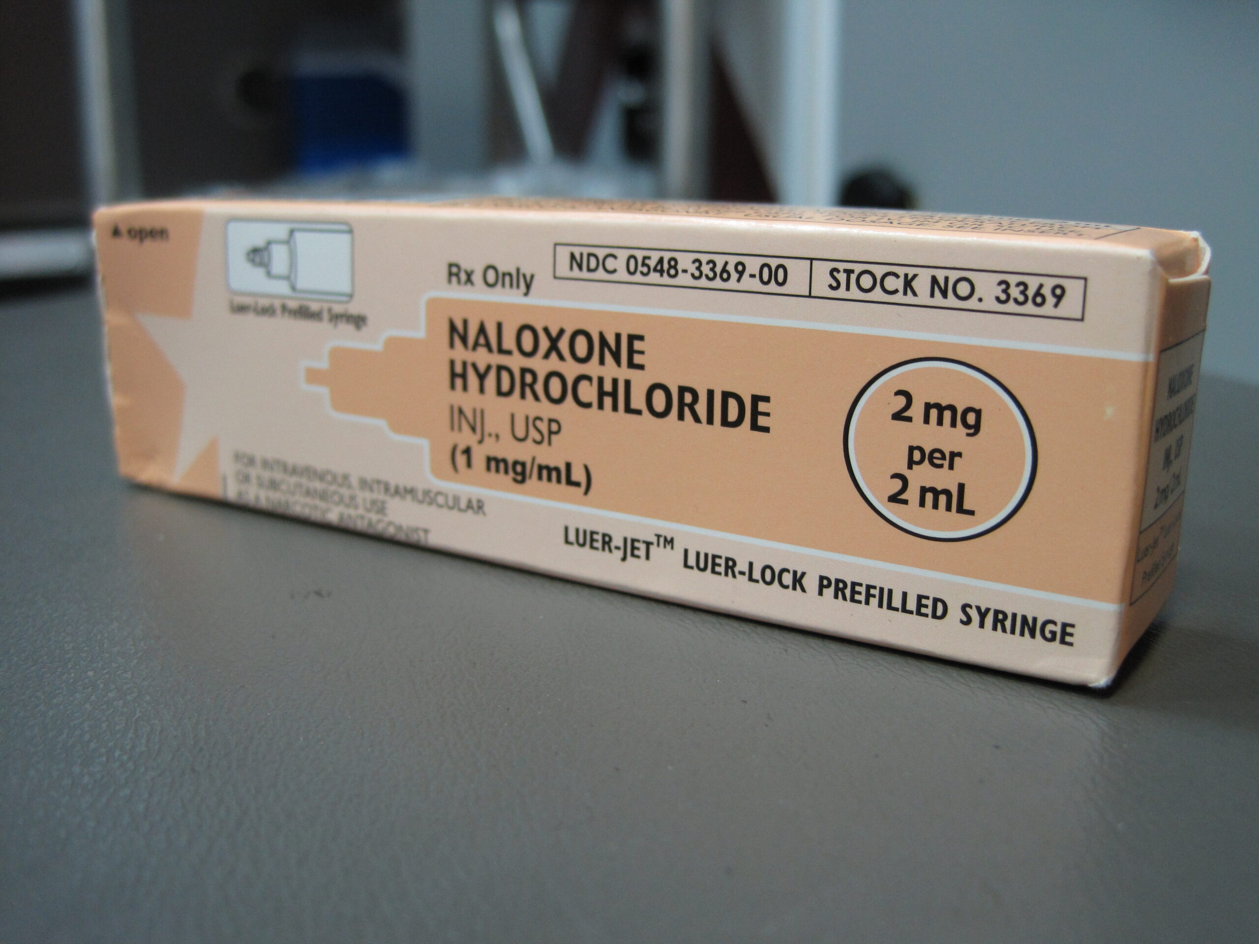 Naloxone medication vials arranged on a medical surface