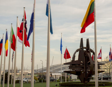 NATO member-country flags waving outside the alliance headquarters in Brussels