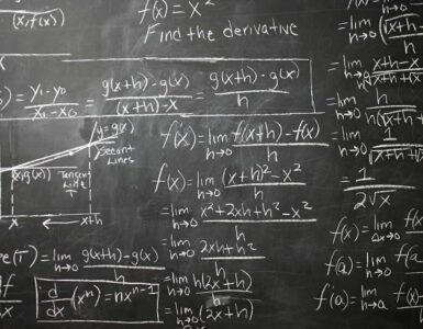 Calculus equations on a blackboard for thinking about partial derivatives and multivariable change