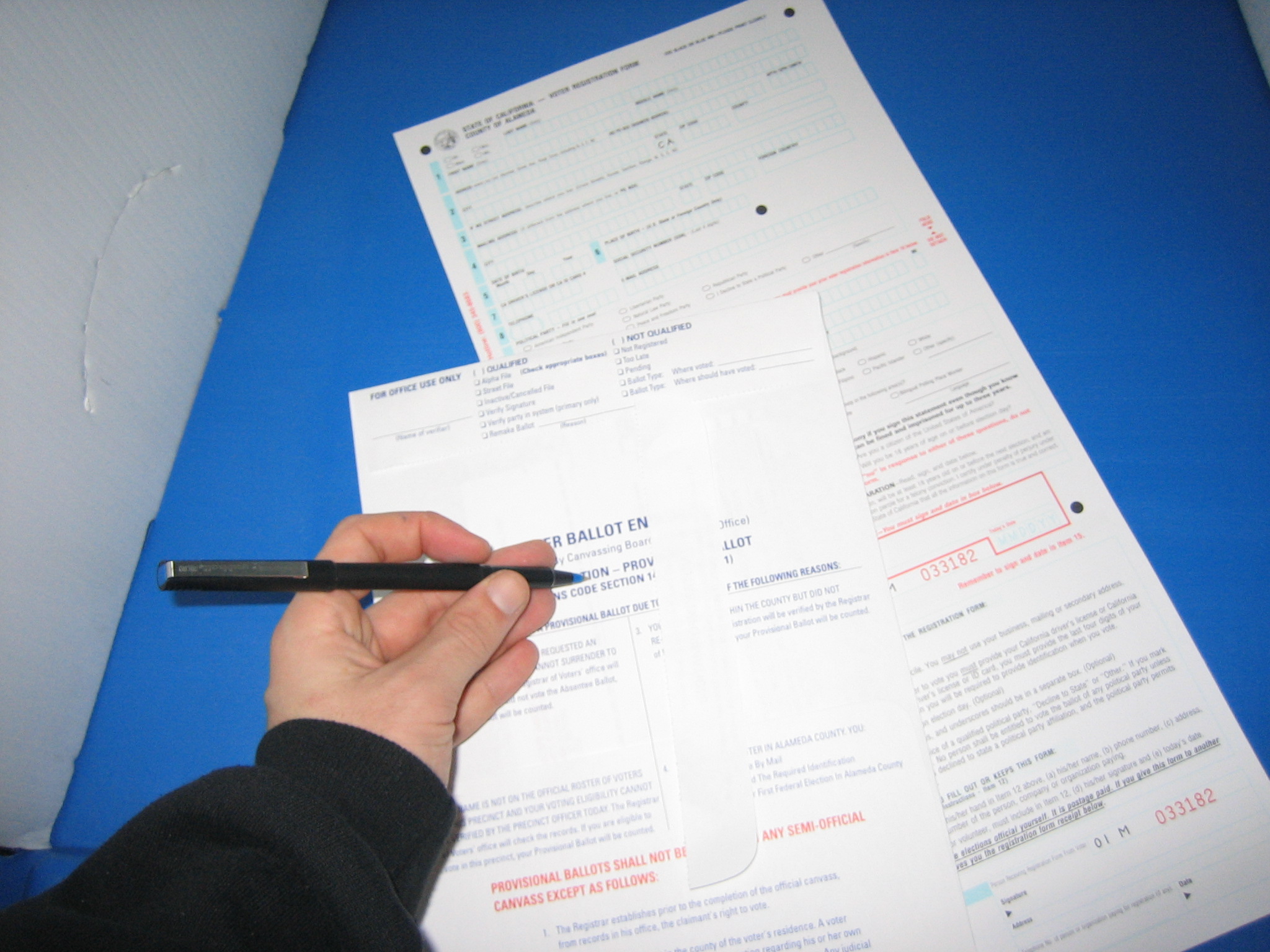 A provisional ballot envelope being handled at a polling place