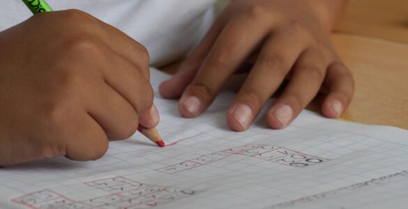 A student works on coordinate-grid notes while practicing angles and trigonometry graphs.