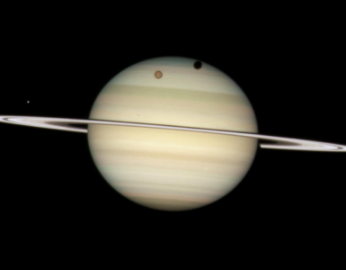 Saturn seen with its rings tilted at a shallow angle against black space