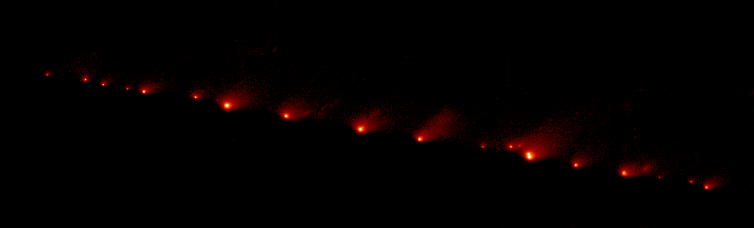 A string of bright fragments from Comet Shoemaker-Levy 9 after it broke apart near Jupiter.