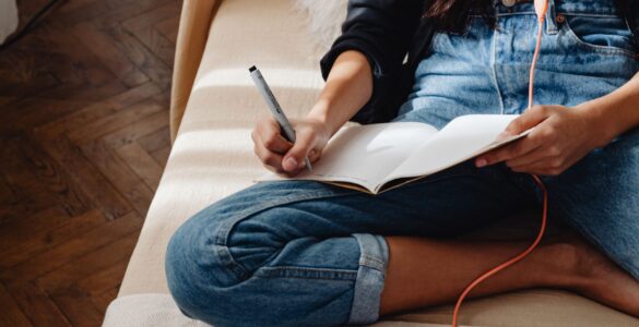 A student organizes notes and review questions for a spaced repetition study schedule.
