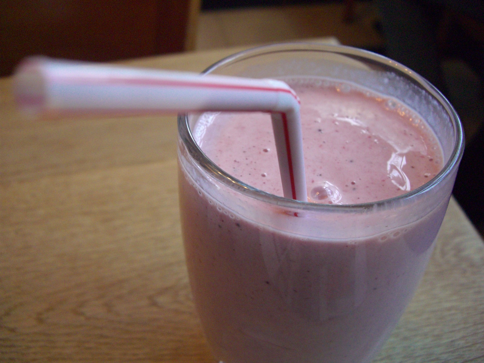 A cold strawberry milkshake showing how frozen desserts soften as ice crystals melt and air pockets collapse