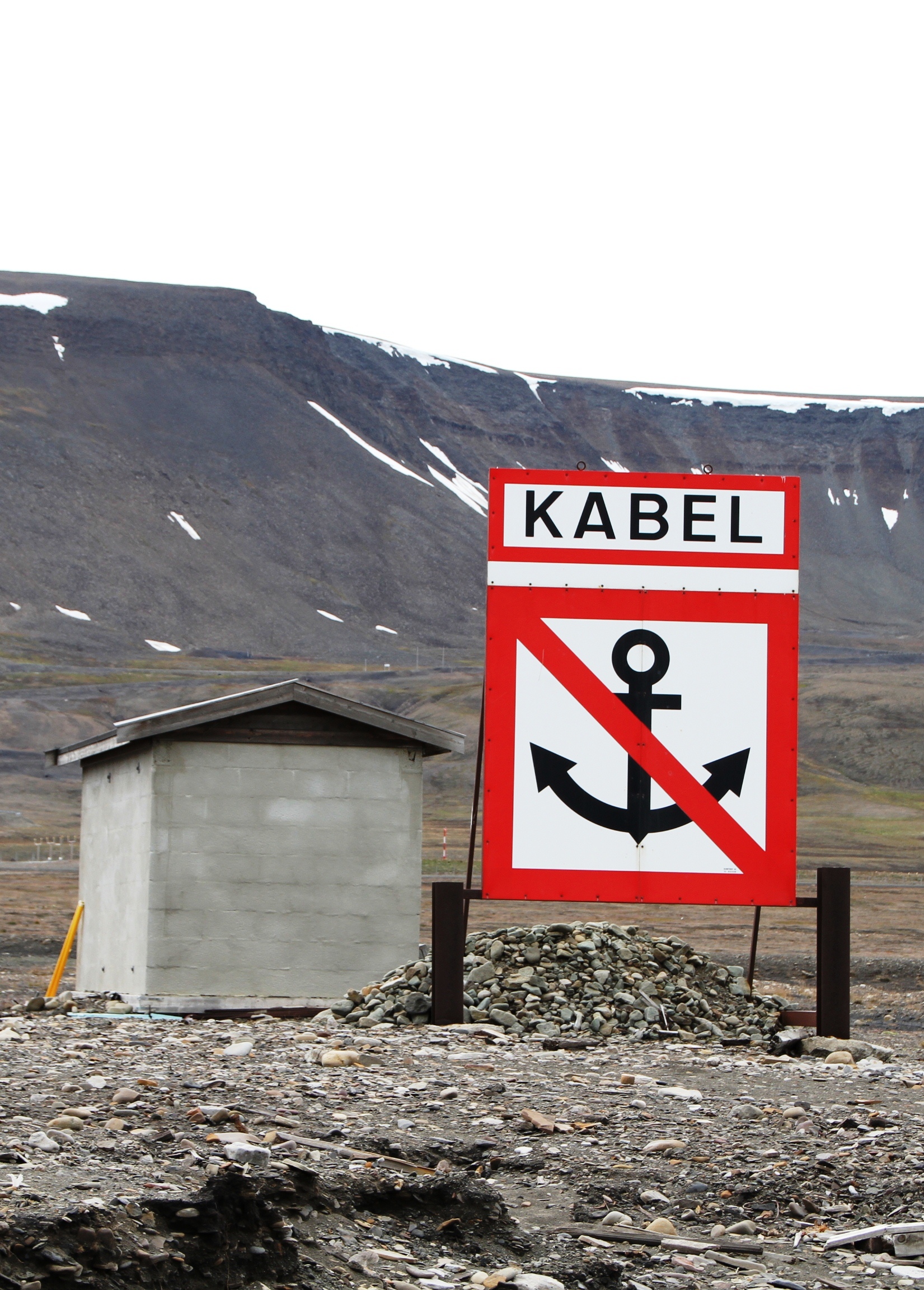 A fiber-optic cable route entering the water on Svalbard before connecting toward the mainland network.
