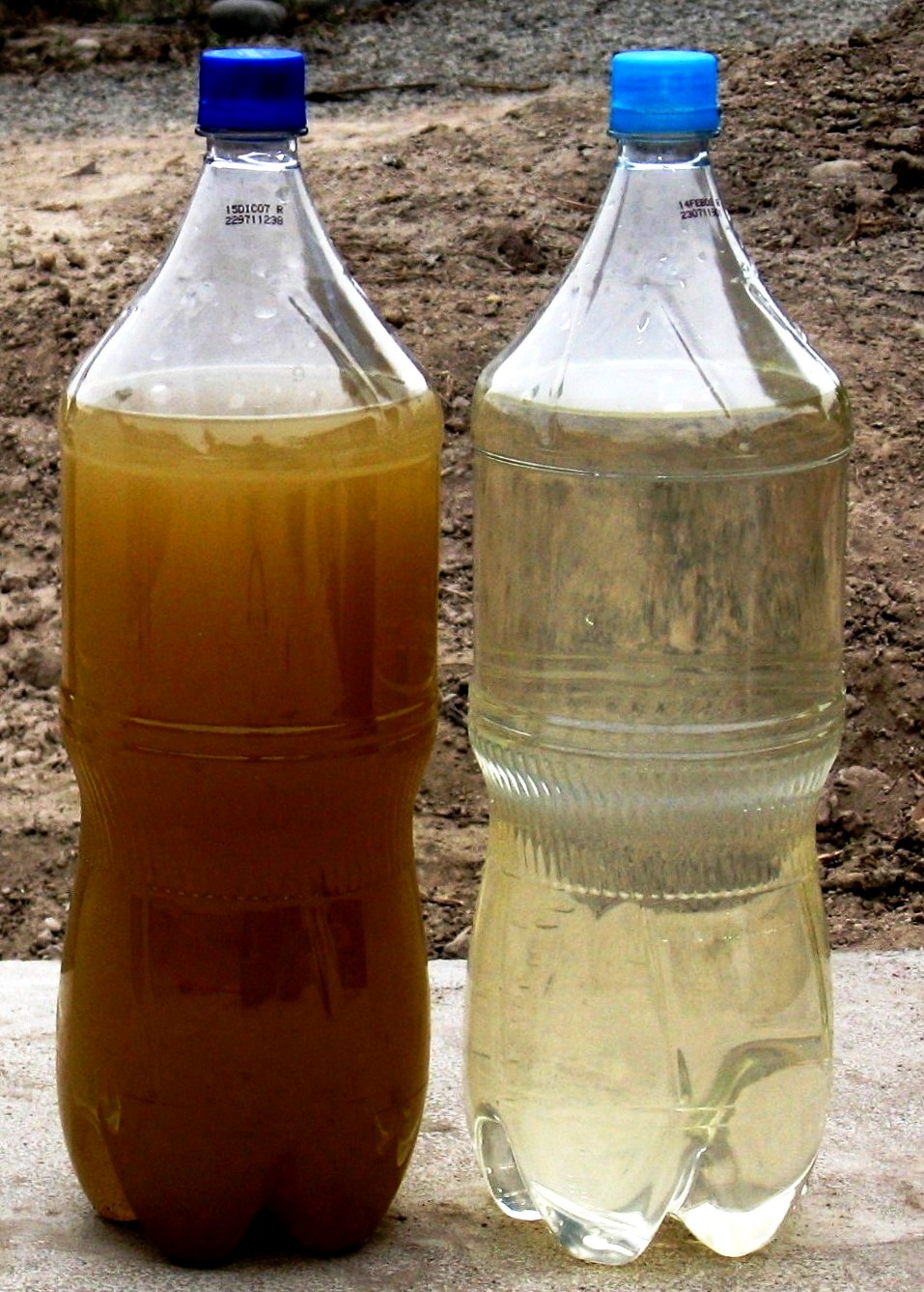 Two bottles showing wastewater samples before and after treatment, illustrating how sewage can carry measurable clues.