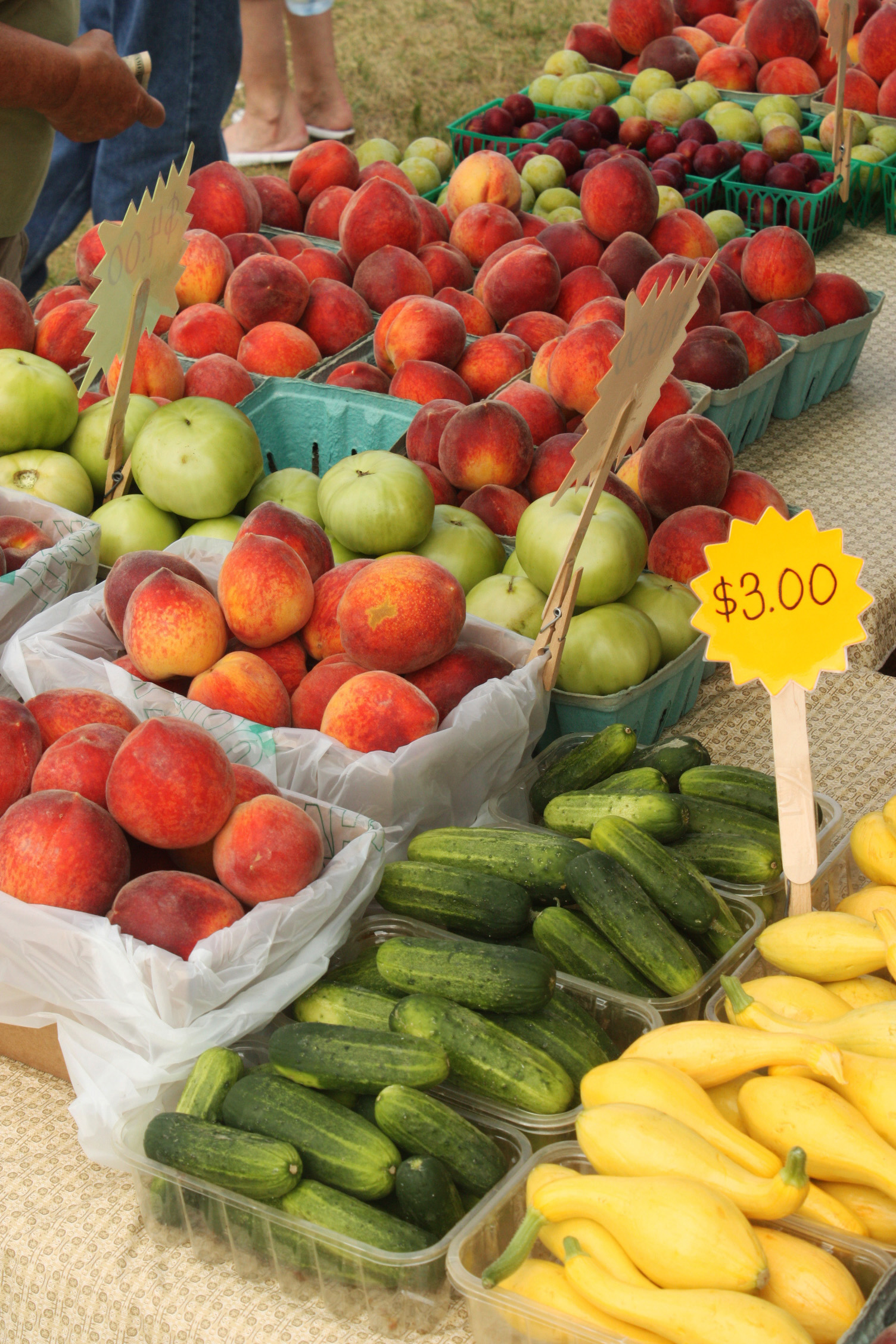 Fresh fruits and vegetables displayed at a farmers market.