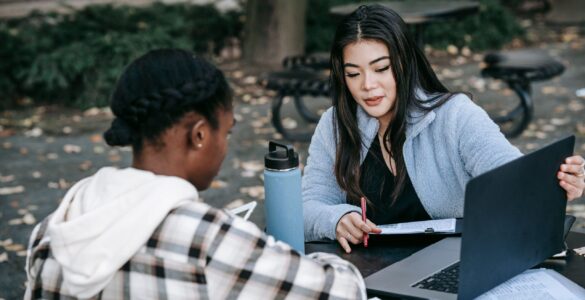People reviewing eligibility paperwork that represents reporting rules for work requirements