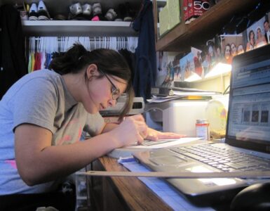 A student study desk with notebooks and materials for unfinished work