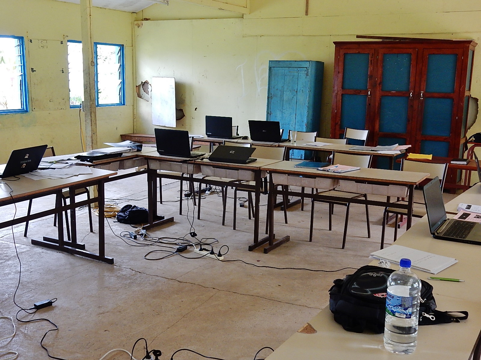 Rows of classroom laptops, representing tools that may support access to assignments, reading, writing, or testing.